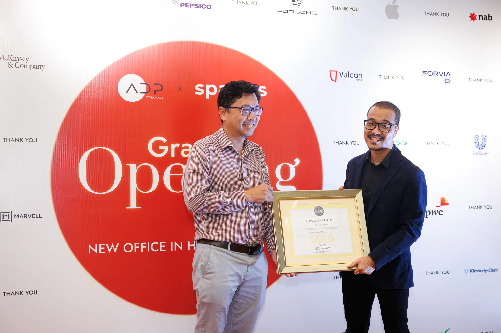 <figcaption>Mr. Quang Do, representing Green Viet, formally presented the prestigious LEED Gold Certificate to Mr. Hua Hoai Nam, recognizing ADP's commitment to sustainable and environmentally responsible design.</figcaption>